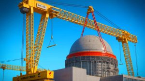 Illustration of the world's largest crane, "Big Carl," lifting a 245-ton dome onto the Hinkley Point C nuclear reactor, generated by artificial intelligence.