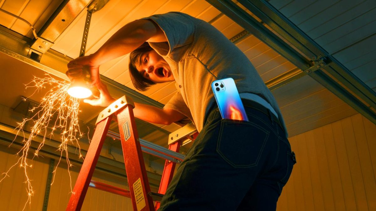 “230 Volt Shock Through My Phone” Exposed The Hidden Danger Lurking In Everyday Electronics You Never Expected Illustration of an individual receiving an electric shock while attempting to replace a light fixture.